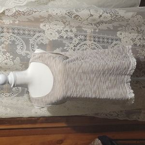Cloth tank top with lace trim on bottom , very dressy with jeans
